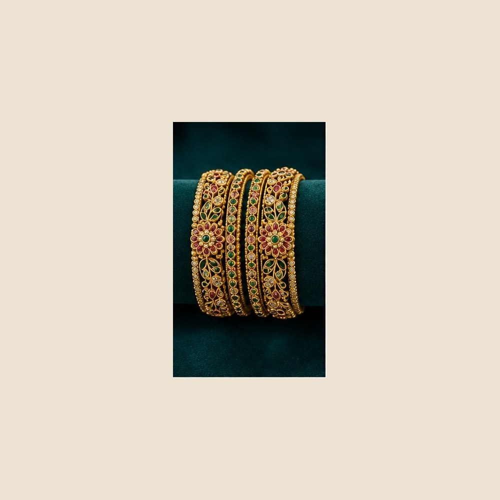 Antique bangle set with ruby and emerald floral work